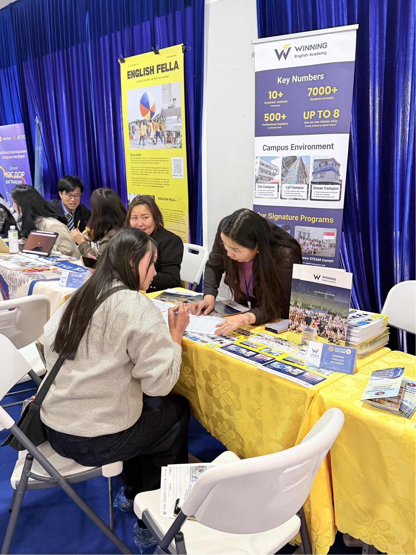Winning English Academy staff consulting Mongolian parents and students at Education Expo 2026